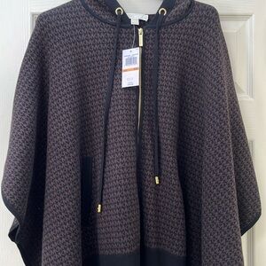 Brand new size s/m poncho/wrap with arm slots.